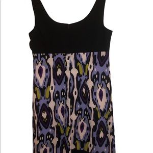 Woman’s poly/spandex knee length dress by Scarlet. Black lavender white lime.